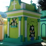 An elaborately decorated tomb freshly painted for the Day of the Dead