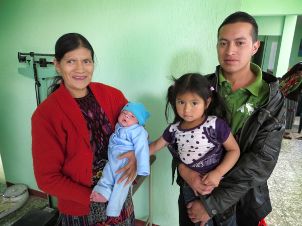 Here is Manuel with his mother, daughter and new son when they visited the clinic to become part of the Milk Program where Chrisi works. His wife died shortly after giving birth to baby Ronny. 