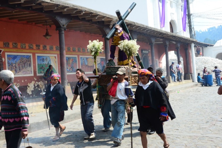 Community and religious leaders carry a sacred statue of Jesus through the streets of Chichicastengango.