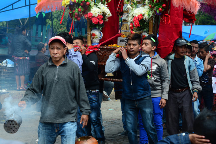 Men carrying the images of saints through the streets of Chichicastenango on All Saints Day Nov. 1, 2016.