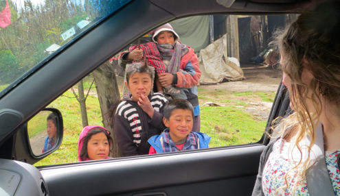 Chrisi is telling the children who wave about the best Christmas gift ever--Jesus! We also gave gifts of rice and beans.