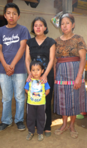 Beatrice, Center with her son Davis and her mother and brother.