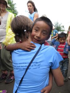 Team members received hugs from kids at the work site.