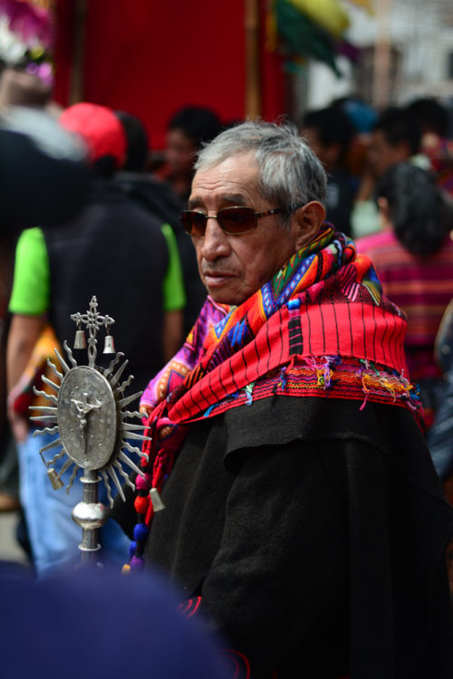 Guardians of the images that are carried through the streets wear traditional garments to stand out from the crowd.